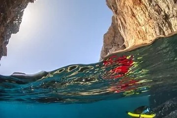 a person swimming in a body of water